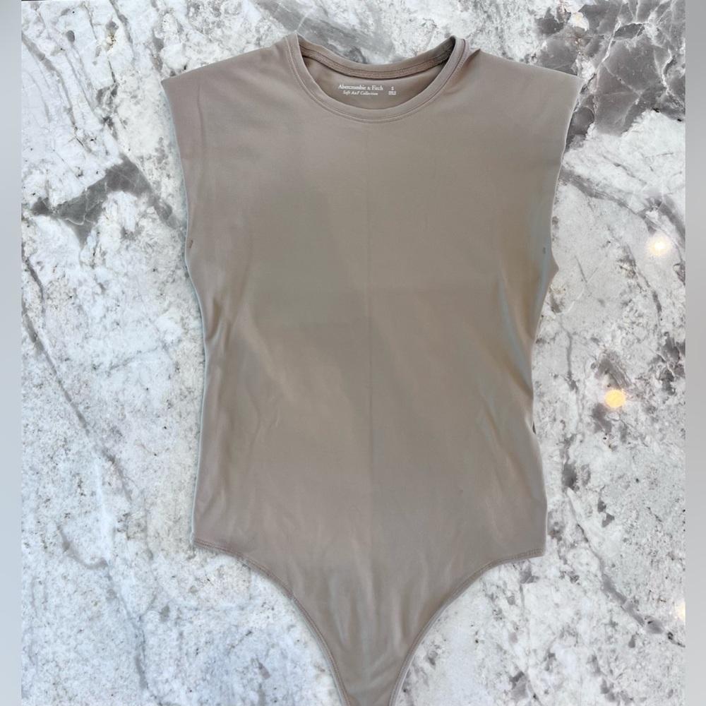 Abercrombie & Fitch “Seamless Cap Sleeve Bodysuit” in color Tan. Size SMALL